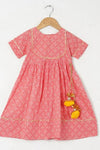 Girls Peach Bandhej Ankle Length Ethnic Gota Dress With Pom Pom