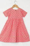 Girls Peach Bandhej Ankle Length Ethnic Gota Dress With Pom Pom
